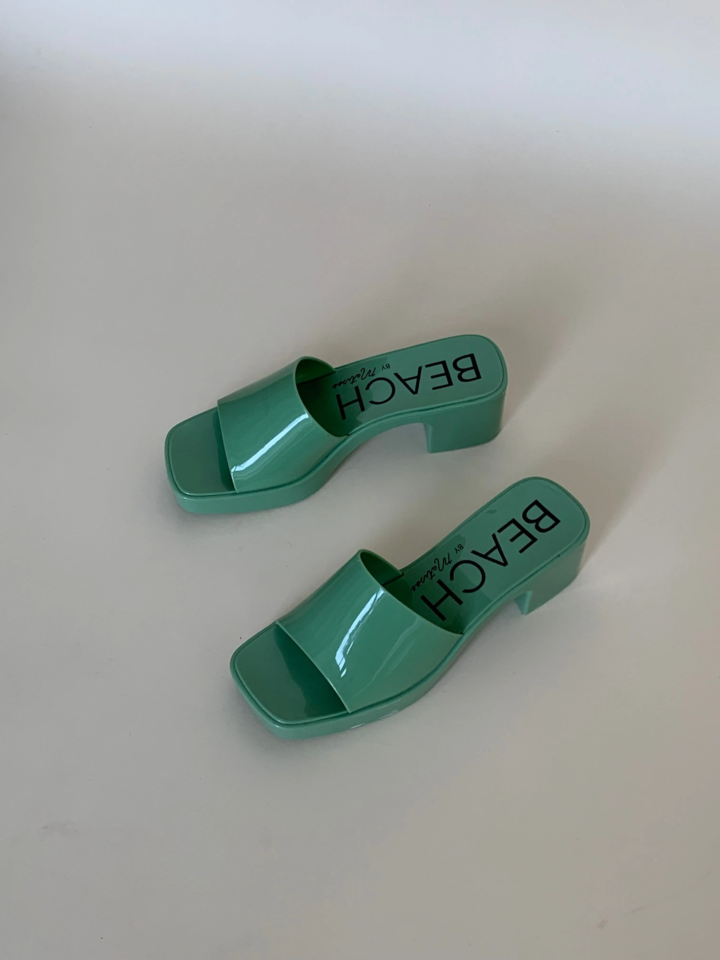 Green plastic sandals