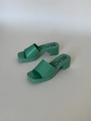 Green plastic sandals