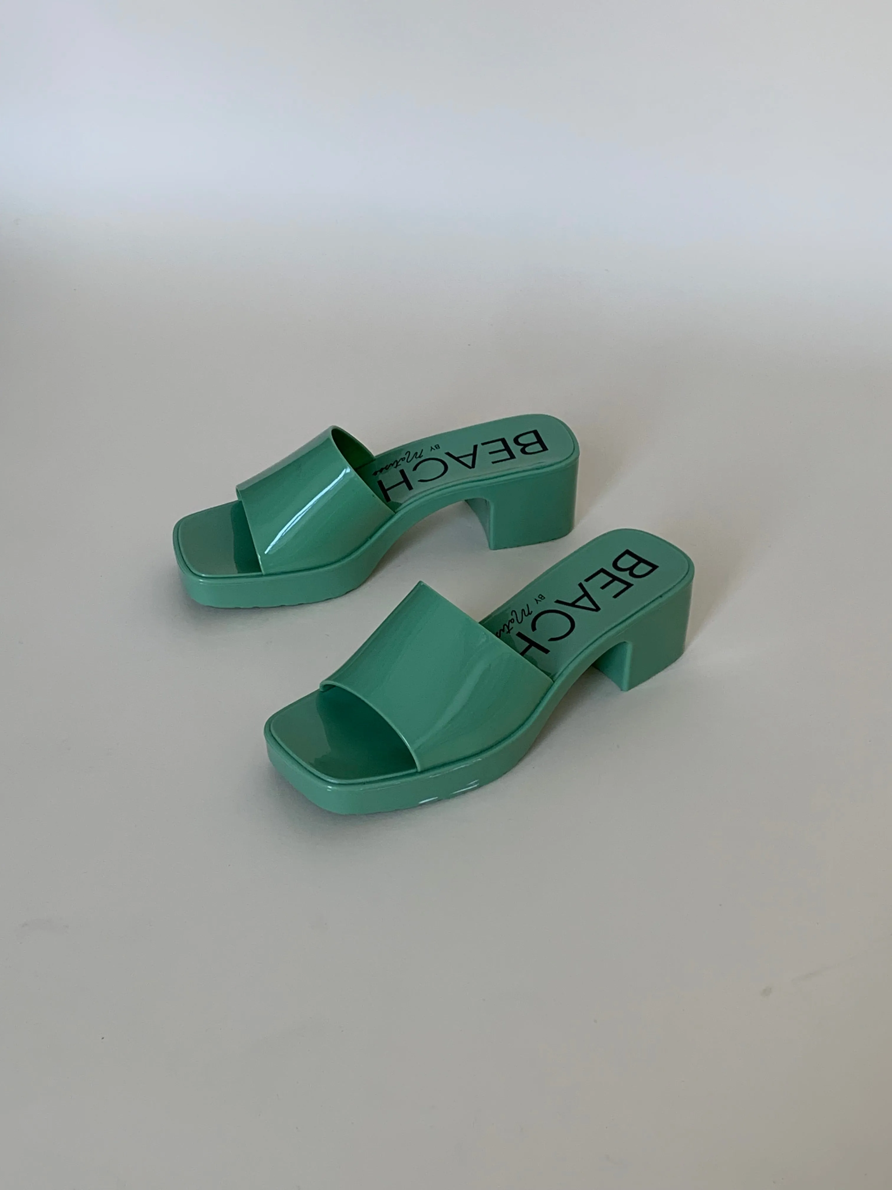 Green plastic sandals